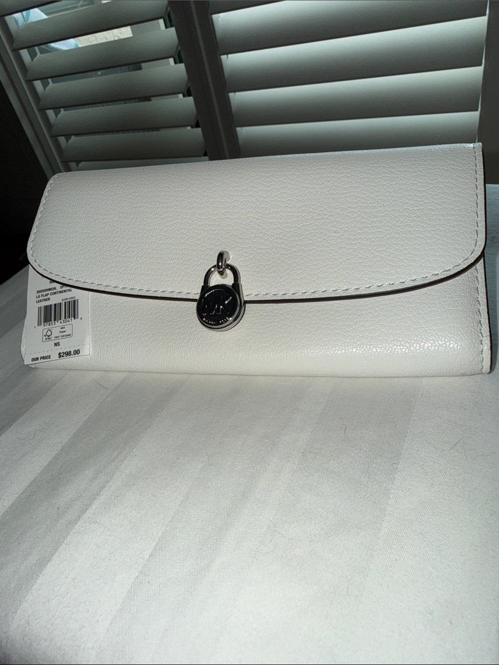 NWT - Michael Kors White Pebbled Leather Clutch with Silver-Tone Logo Charm.